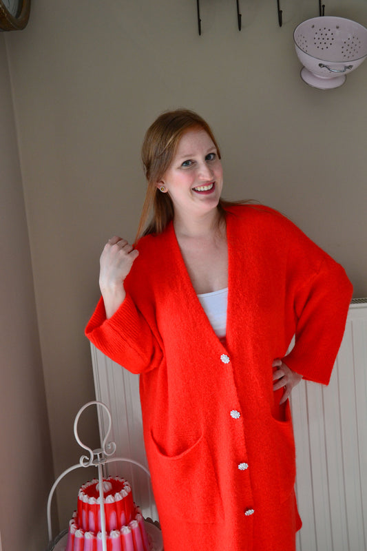 orange gilet flower button